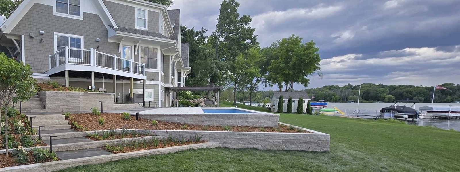 Custom Long Lake In-Ground Pool and Planking Stone Terrace Project