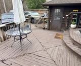 Existing backyard deck with composite decking and outdoor furniture