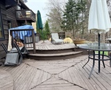 Raised composite deck and curved steps before renovation