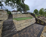 Stone steps and retaining walls in waterfront hardscape project in Champlin, MN