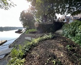 Shoreline before restoration and erosion control work in Champlin, MN
