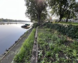 Eroded waterfront shoreline before stabilization project in Champlin, MN
