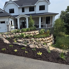 Completed native planting and stormwater repair project at a residential property in Eden Prairie
