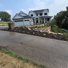 Native landscape installation with stormwater drainage improvements at an Eden Prairie home